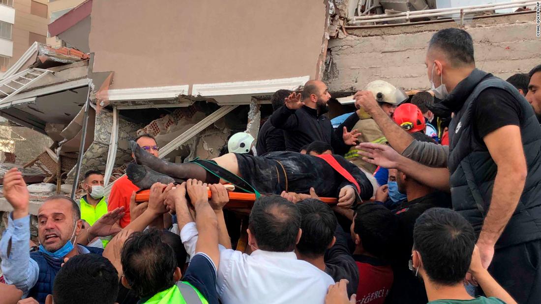 A wounded person is rescued from a collapsed building in Izmir.
