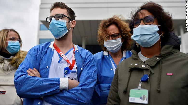 Employees at the MontLegia hospital, in Liege, Belgium, as wards face a surge in admissions.