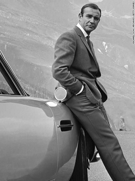 1964: Actor Sean Connery poses as James Bond next to his Aston Martin DB5 in a scene from the United Artists release &#39;Goldfinger&#39; in 1964 Photo by Michael Ochs Archives/Getty Images