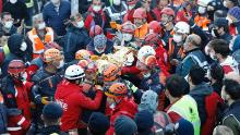 A three-year-old survivor is pulled from rubble left by an earthquake in the Turkish town of Izmir on November 2, 2020. 