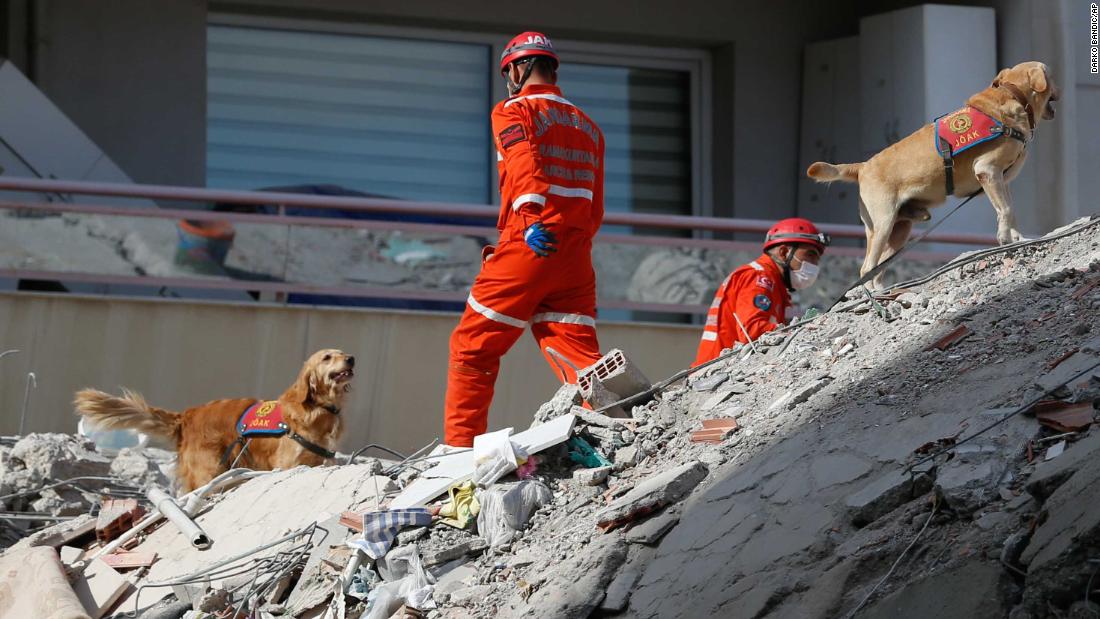 Rescuers search debris for survivors in Izmir.