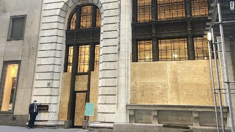 A Tiffany store boarded up in New York. Tiffany and other retailers are bracing for election-related unrest.