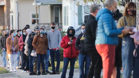 Voters wait in line to cast ballots in the presidential election on November 2, 2020 in Cedar Rapids, Iowa. 