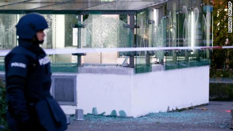 A police officer patrols after a shooting, in Vienna, Austria.