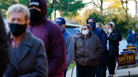 People line up outside a polling place to vote in the 2020 general election in the United States, Tuesday, Nov. 3, 2020, in Springfield, Pa. (AP Photo/Matt Slocum)