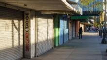 A pedestrian walks down El Paso Street, a major shopping area, on October 23, 2020 in downtown El Paso, Texas. - El Paso&#39;s downtown has always been reliant on shoppers from neighboring Ciudad Juarez, but the border closure to non-essential traffic from Mexico has hurt businesses, whose main clientele is Mexican shoppers. (Photo by Paul Ratje/AFP/Getty Images)