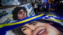 Maradona fans gather outside the hospital where he underwent brain surgery for a blood clot.