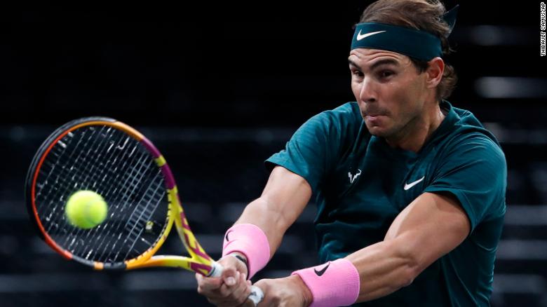 Nadal returns a backhand to compatriot Lopez. 