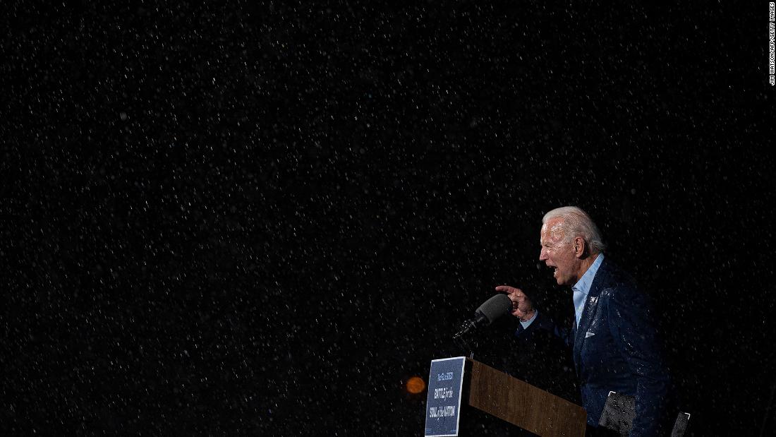 Biden delivers remarks in the rain during a drive-in rally in Tampa, Florida, in October 2020.