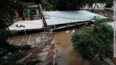 CORTES, HONDURAS - NOVEMBER 05: The debris of a home remain under the water after the flow of Chamelecon river increased due to the rain caused by tropical storm Eta on November 05, 2020 in Cortes, Honduras. Eta made landfall as a Category 4 hurricane in Nicaragua causing catastrophic winds, flash flooding and landslides across some areas of Central America. The hurricane downgraded to tropical storm while hitting Honduras. (Photo by Yoseph Amaya/Getty Images)