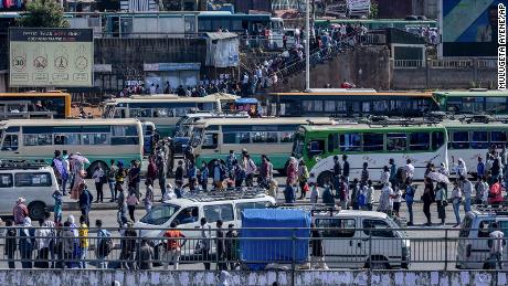 Passengers queue to get on buses in Addis Ababa, Ethiopia on  November 6.