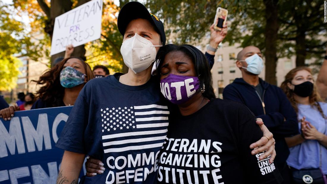 People gather at the Black Lives Matter Plaza in Washington, DC.