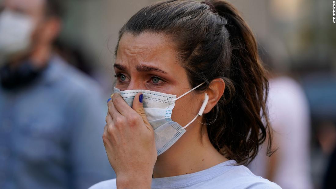 Olivia Cox reacts to Biden&#39;s win at the Black Lives Matter Plaza in Washington, DC.