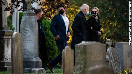 Former Vice President Joe Biden, the Democratic presidential nominee, walks arm in arm with his granddaughter Finnegan Biden as they arrive to visit the grave of his son Beau Biden at St. Joseph on the Brandywine Church in Wilmington, Del., on Election Day morning.