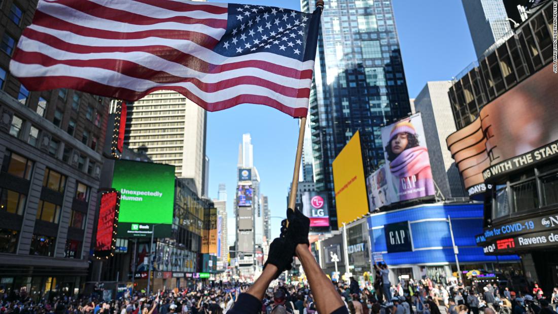 New Yorkers gather in Times Square to celebrate Biden&#39;s win.