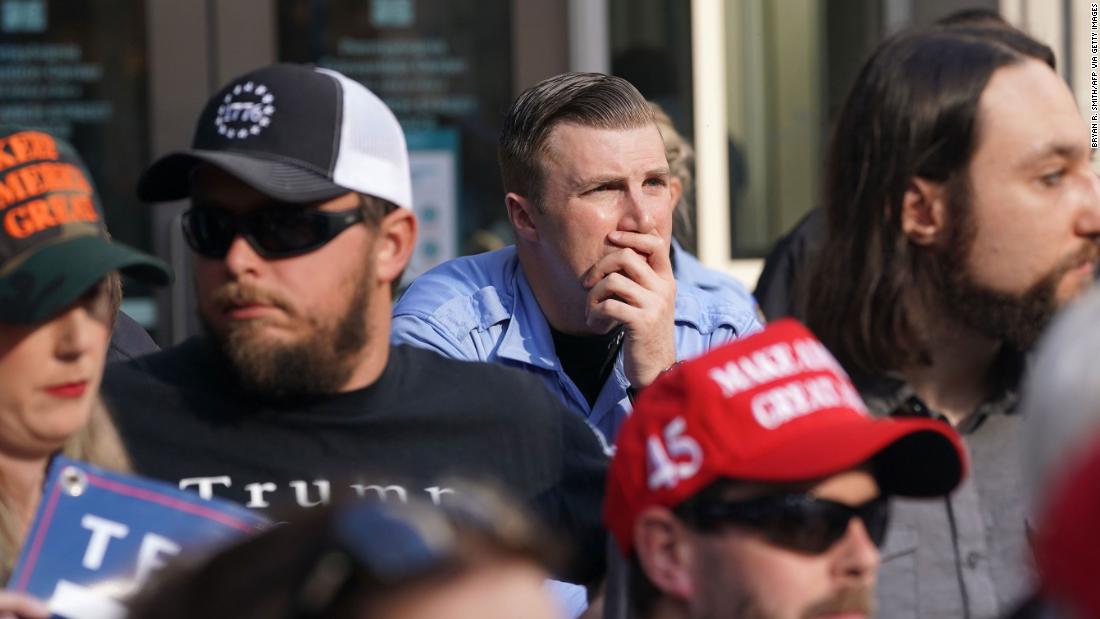 Trump supporters look on outside the Pennsylvania Convention Center.