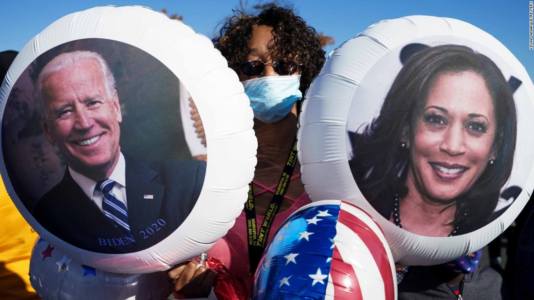 A Biden supporter holds balloons at the site of a victory party in Wilmington, Delaware.