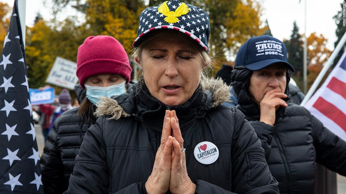 Supporters of President Donald Trump pray during a rally to protest against President-elect Joe Biden&#39;s win Saturday, Nov. 7, 2020 in Salem, Ore. 