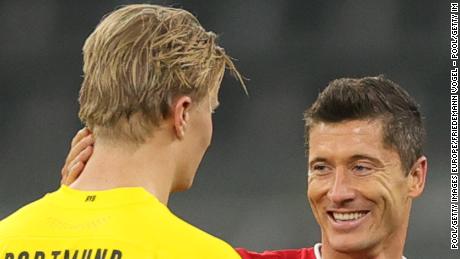 Erling Haaland of Dortmund and Robert Lewandowski Bayern Munich chat after the Bavarian club&#39;s 3-2 win at Signal Iduna Park.
