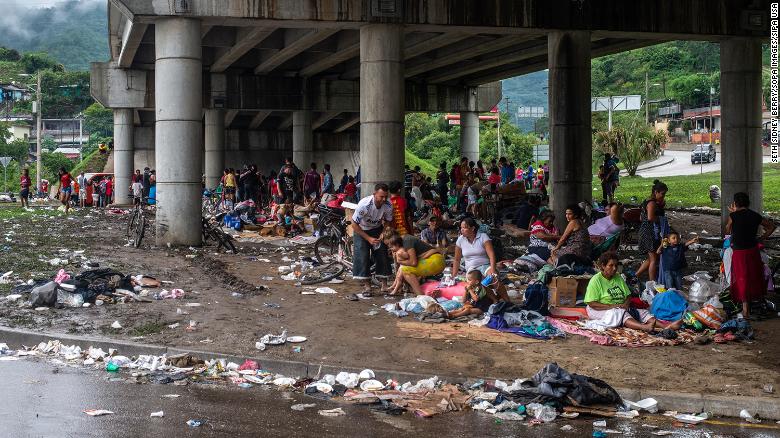 People who were forced to abandon their homes in the San Pedro Sula Valley due to floods in the aftermath of Hurricane Eta take refuge in a makeshift camp underneath an overpass in Chemelecon, Honduras.