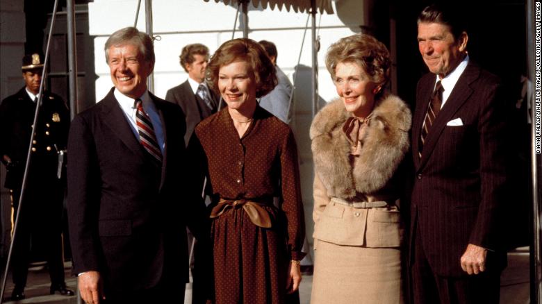 President-elect Ronald Reagan and wife Nancy stand with President Jimmy Carter wife Rosalynn outside the White House on November 1, 1980.