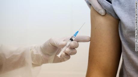 A heath worker prepares to inject the Sputnik V vaccine into a patient's arm during a trial at the City Clinic #46 in Moscow, Russia, on September 23.