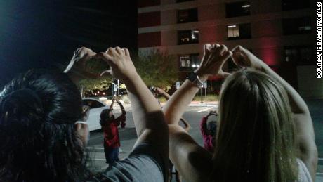 Daniel Morales' family prayed outside the hospital every night, crossing their hands in the shape of a heart and lifting them up in the air, for nearly a month before succumbing to Covid-19.  (Credit: Minvera Morales)