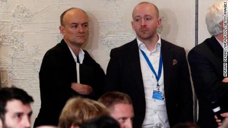 Dominic Cummings, left, and Lee Cain, right, attend a press conference by Boris Johnson in December 2019 in Watford, England.
