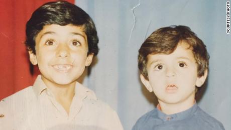 Naser Alazari, right, is photographed with his brother, Sayf, while living in Iraq. 