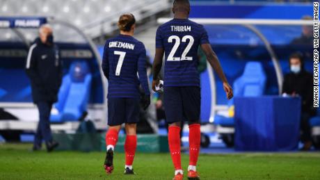 France&#39;s Marcus Thuram and Antoine Griezmann leave the field after defeat by Finland. 