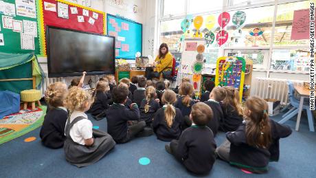 Younger students attend class in Knutsford, England, at the start of a four-week national lockdown on November 4.