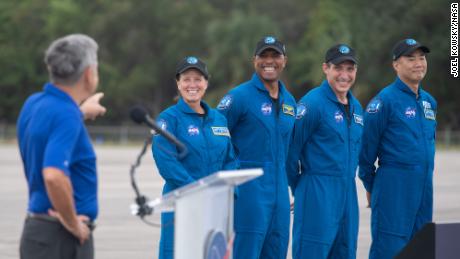 NASA astronauts Shannon Walker, left, Victor Glover, second from left, Mike Hopkins, second from right, and Japan Aerospace Exploration Agency (JAXA) astronaut Soichi Noguchi, right, are introduced by Kennedy Space Center Director Bob Cabana after arriving at the Launch and Landing Facility at NASA&#39;s Kennedy Space Center ahead of SpaceX&#39;s Crew-1 mission, Sunday, Nov. 8, 2020, in Florida. NASA&#39;s SpaceX Crew-1 mission is the first operational mission of the SpaceX Crew Dragon spacecraft and Falcon 9 rocket to the International Space Station as part of the agency&#39;s Commercial Crew Program. Hopkins, Glover, Walker, Noguchi are scheduled to launch at 7:49 p.m. EST on Saturday, Nov. 14, from Launch Complex 39A at the Kennedy Space Center. (Joel Kowsky/NASA)