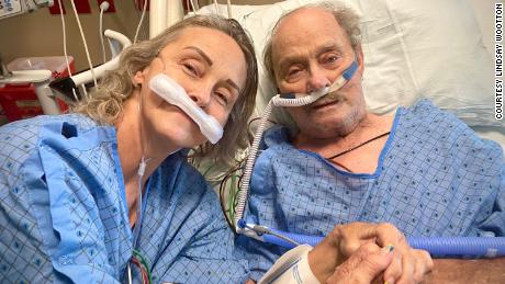 Tracy Larsen, 56, with her father, Burt Porter, 80, shares a moment together in an intensive care unit shortly before losing their battles with Covid-19.