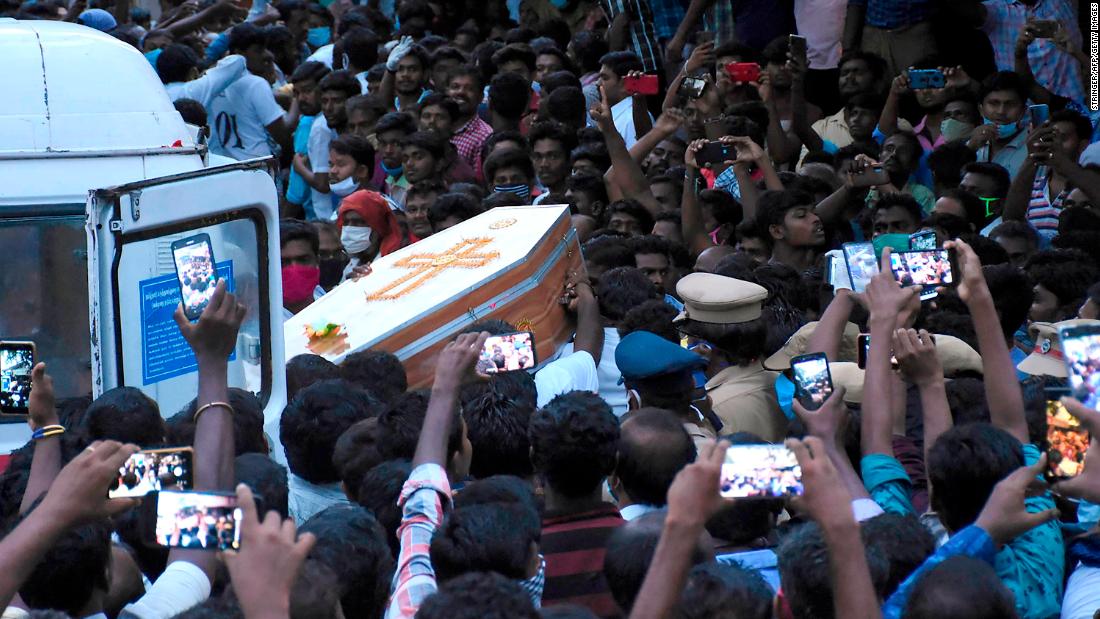 Residents gather as they carry the coffin of Jayaraj and son Bennicks, who were allegedly tortured at the hands of police in Sathankulam.