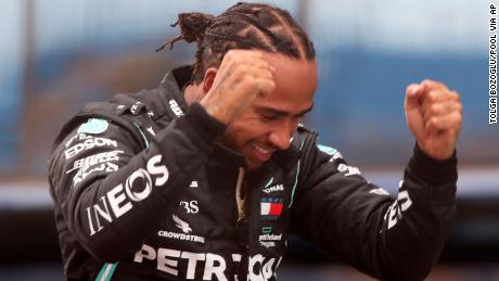 Mercedes driver Lewis Hamilton of Britain reacts after winning the Formula One Turkish Grand Prix at the Istanbul Park circuit racetrack in Istanbul, Sunday, Nov. 15, 2020. (Tolga Bozoglu/Pool via AP)