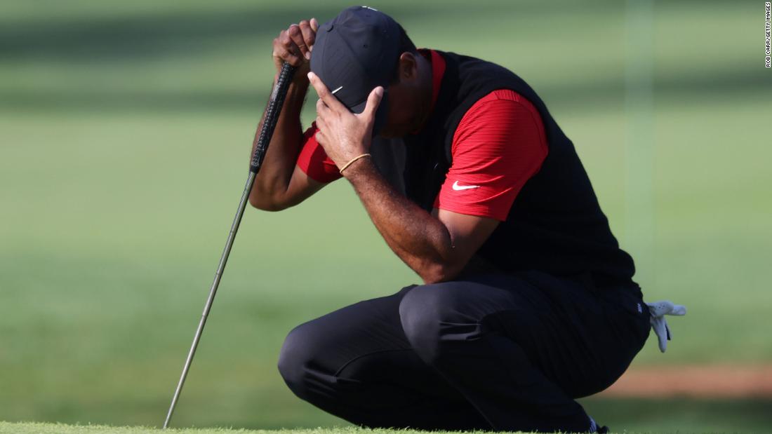 Tiger Woods of the United States reacts on the seventh green during his topsy-turvy round which included a 10 on the short 12th.