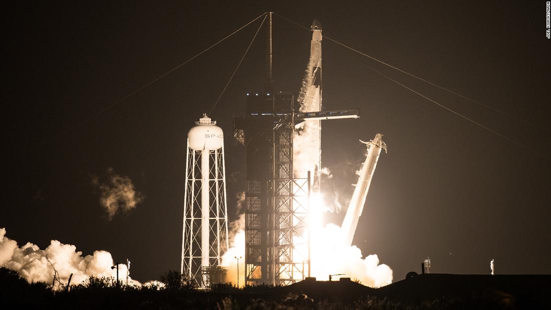 A SpaceX Falcon 9 rocket carrying the company&#39;s Crew Dragon spacecraft lifts off for the International Space Station.