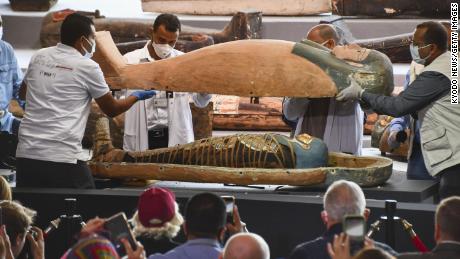 Archaeologists find 100 ancient Egyptian coffins, some with mummies, at burial complex