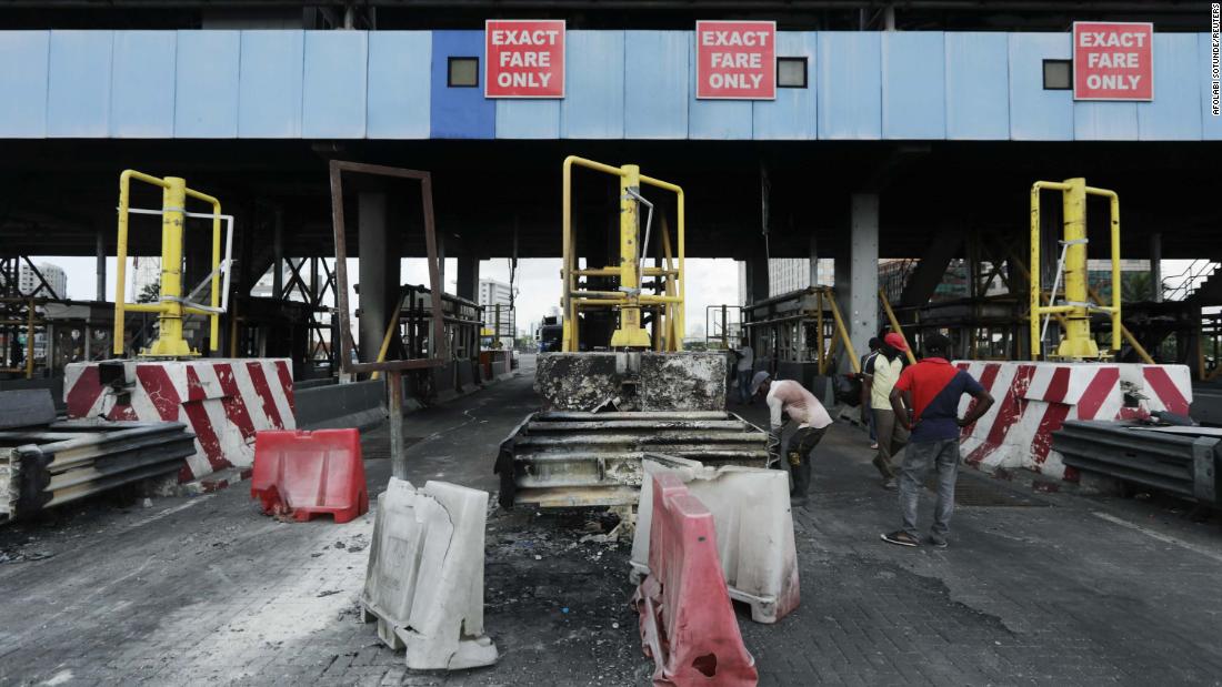Workers clean up the Lekki toll gate on October 24.