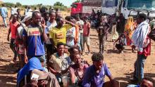 Ethiopian refugees fleeing Tigray line up to receive supplies at the Um Rakuba camp in Sudan's eastern Gedaref province, on November 16, 2020.