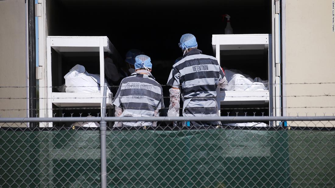 Inmates from the El Paso County detention facility load bodies into a refrigerated trailer at the El Paso County Medical Examiner&#39;s Office in Texas on November 16. The inmates were &lt;a href=&quot;http://www.cnn.com/2020/11/16/us/el-paso-inmate-covid-bodies-trnd/index.html&quot; target=&quot;_blank&quot;&gt;temporarily relieving overworked personnel&lt;/a&gt; at the office.