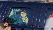 Trump waves to supporters protesting the results of the presidential election, as the presidential motorcade drives by the &quot;Million MAGA March&quot; rally, at Freedom Plaza in Washington on Saturday, November 14.