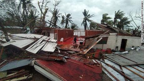 A man walks trough the severely damaged building of Hospedaje Cortijo 2 inn in Puerto Cabezas, Nicaragua.