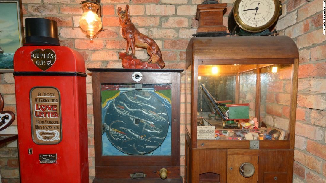 The Broughs&#39; memorabilia included old-fashioned arcade machines. Here, a wooden claw machine can be seen on the right, filled with old toys. The claw was operated by hand, after depositing sixpence in the slot.