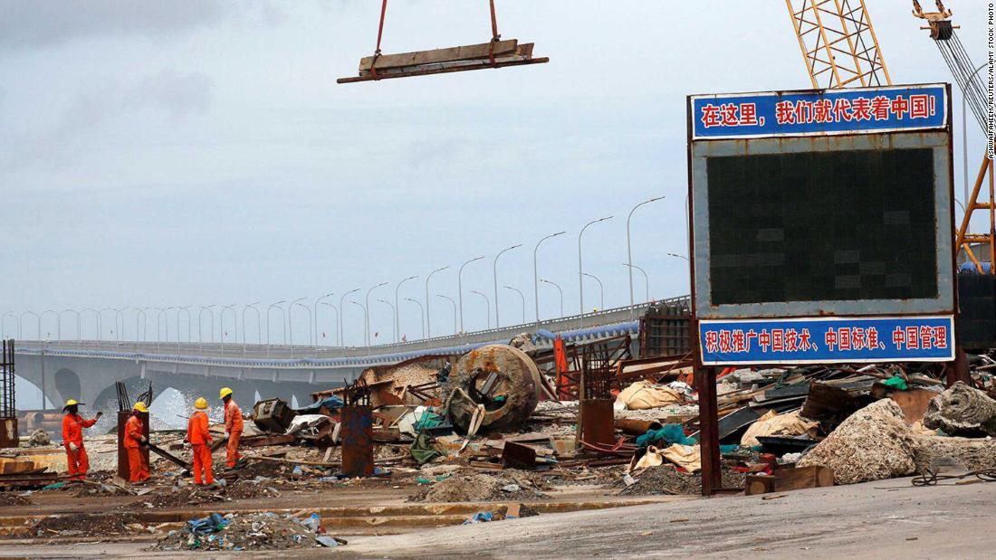A signboard at the construction site of the China-Maldives Friendship Bridge reads: &quot;Here, we represent China!&quot; 