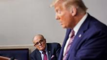 WASHINGTON, DC - SEPTEMBER 27: Former New Jersey Governor Chris Christie and former New York Mayor Rudy Giuliani listen as U.S. President Donald Trump speaks during a news conference in the Briefing Room of the White House on September 27, 2020 in Washington, DC. Trump is preparing for the first presidential debate with former Vice President and Democratic Nominee Joe Biden on September 29th in Cleveland, Ohio. (Photo by Joshua Roberts/Getty Images)