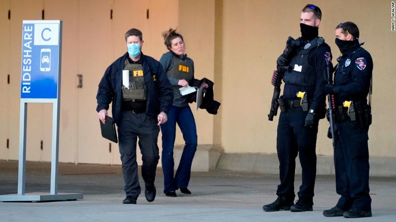 Police and FBI agents investigate a shooting at Mayfair Mall in Wauwatosa, Wisconsin, on Friday, November 20. 
