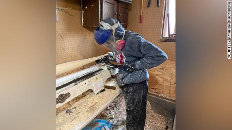 Rhomberg carving one of his homemade bats.