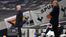 Mourinho and Guardiola look on during the match between Tottenham Hotspur and Manchester City.