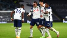 Lo Celso celebrates with his teammates after scoring his team's second goal against Manchester City. 